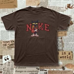 Brown Pete The Cat Tee With Graphic Of A Cartoon Cat Playing A Guitar